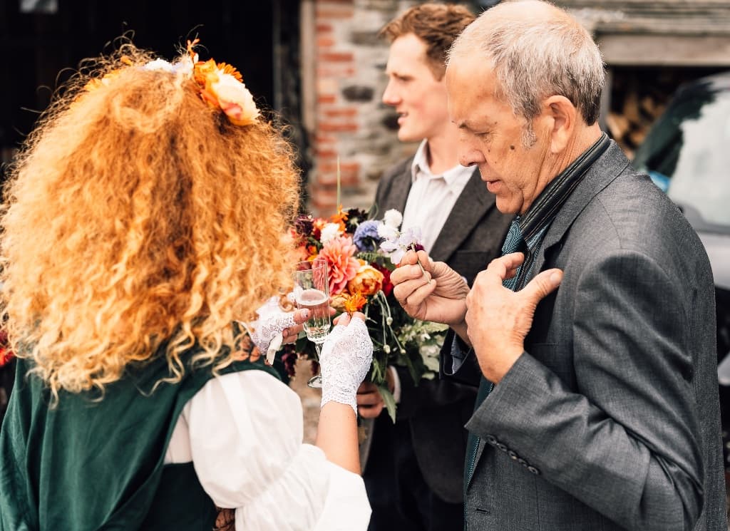 Bride with bouquet and guests