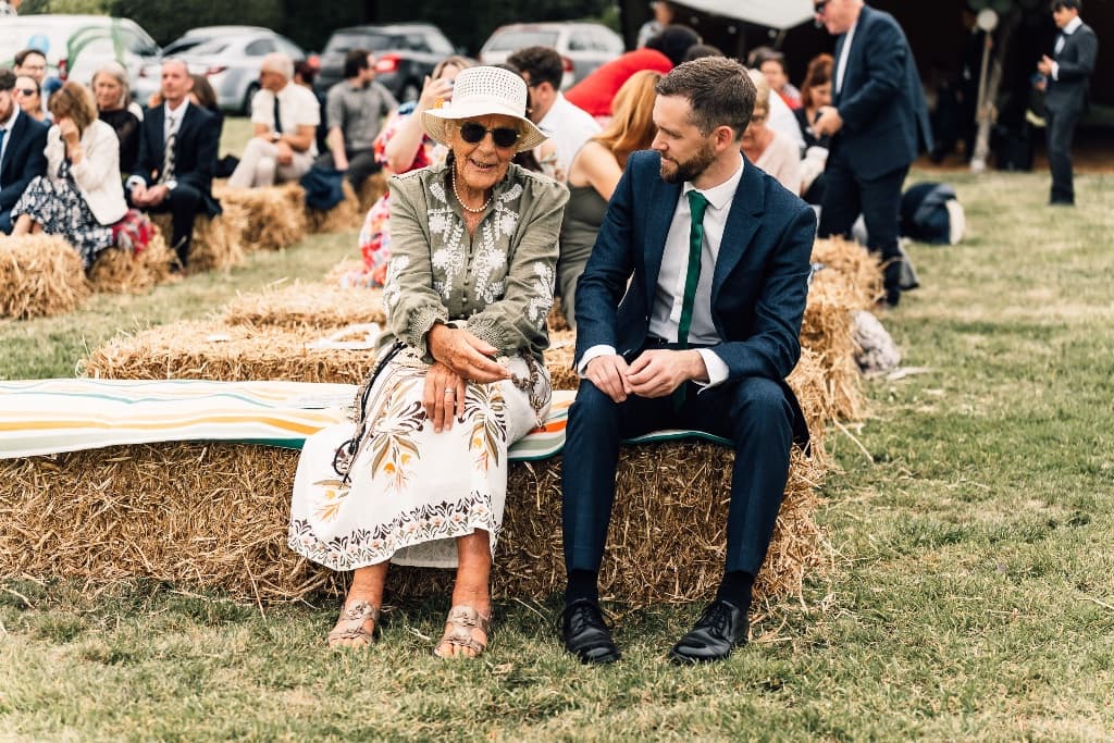 Wedding guests on hay bales